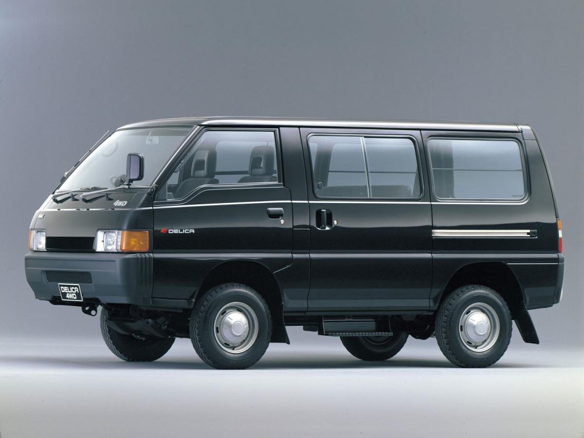 An photograph of a real, black minivan